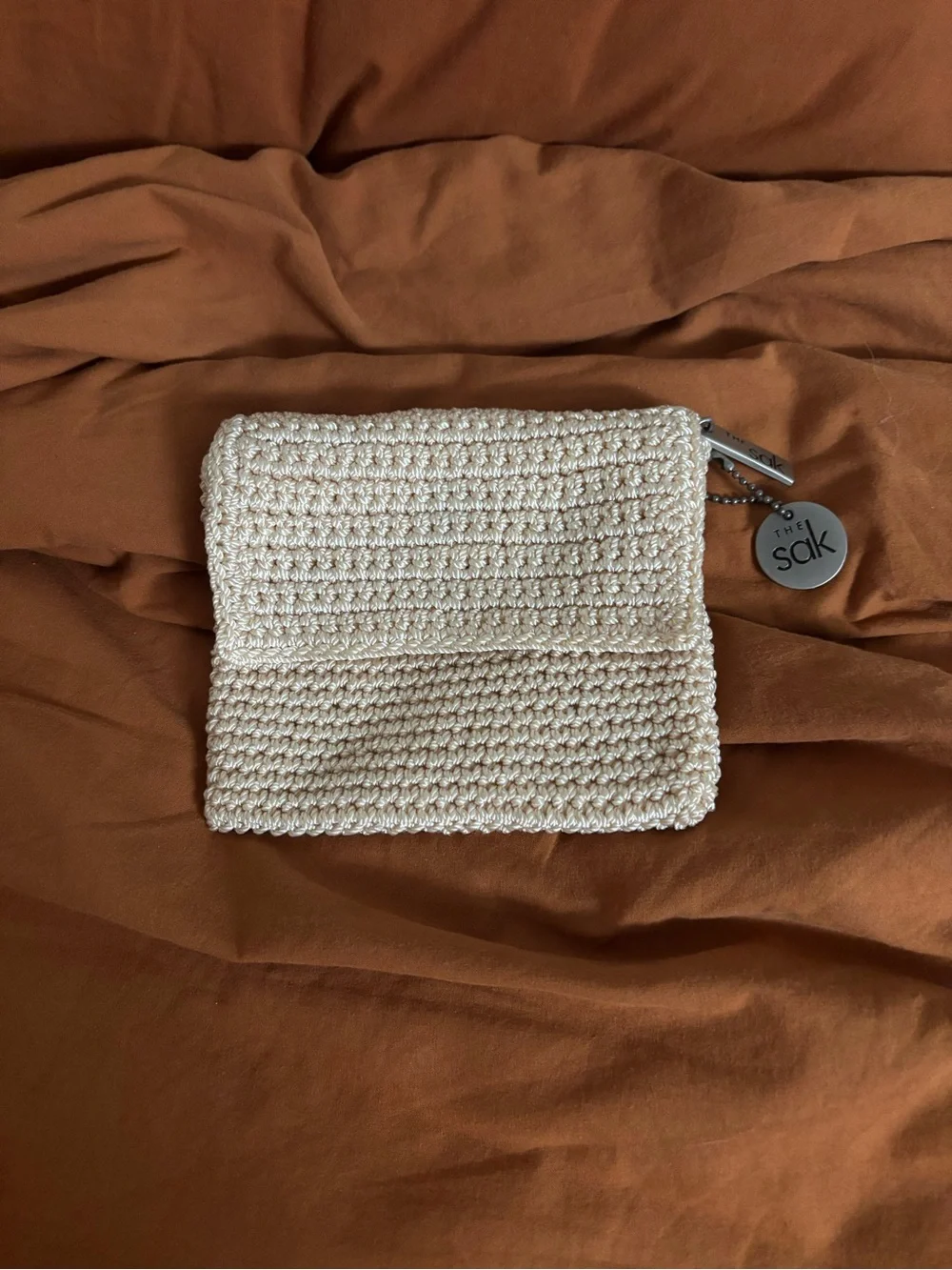 The Sak Cream Crochet Fold-Over Wallet with Logo Charm